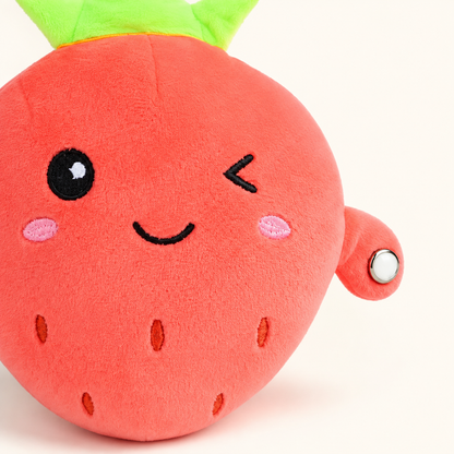 Close-up of the strawberry Plush Pal fabric, embroidery and metallic touch sensor